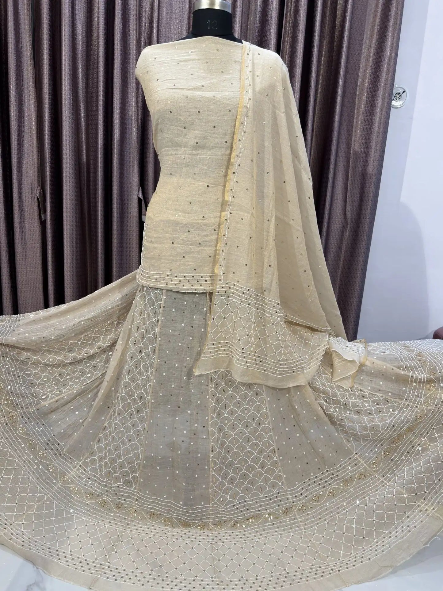 Checks Lucknowi Chikankari Lehenga showcasing handcrafted check-pattern embroidery.