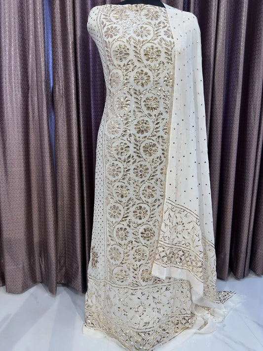 Close-up of floral jaal embroidery with handcrafted Badla and Mukaish work on a white Pure Georgette kurta