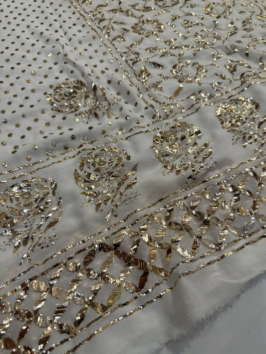 Close-up of handcrafted Badla and Mukaish embroidery on an off white Lucknowi Kurta Set