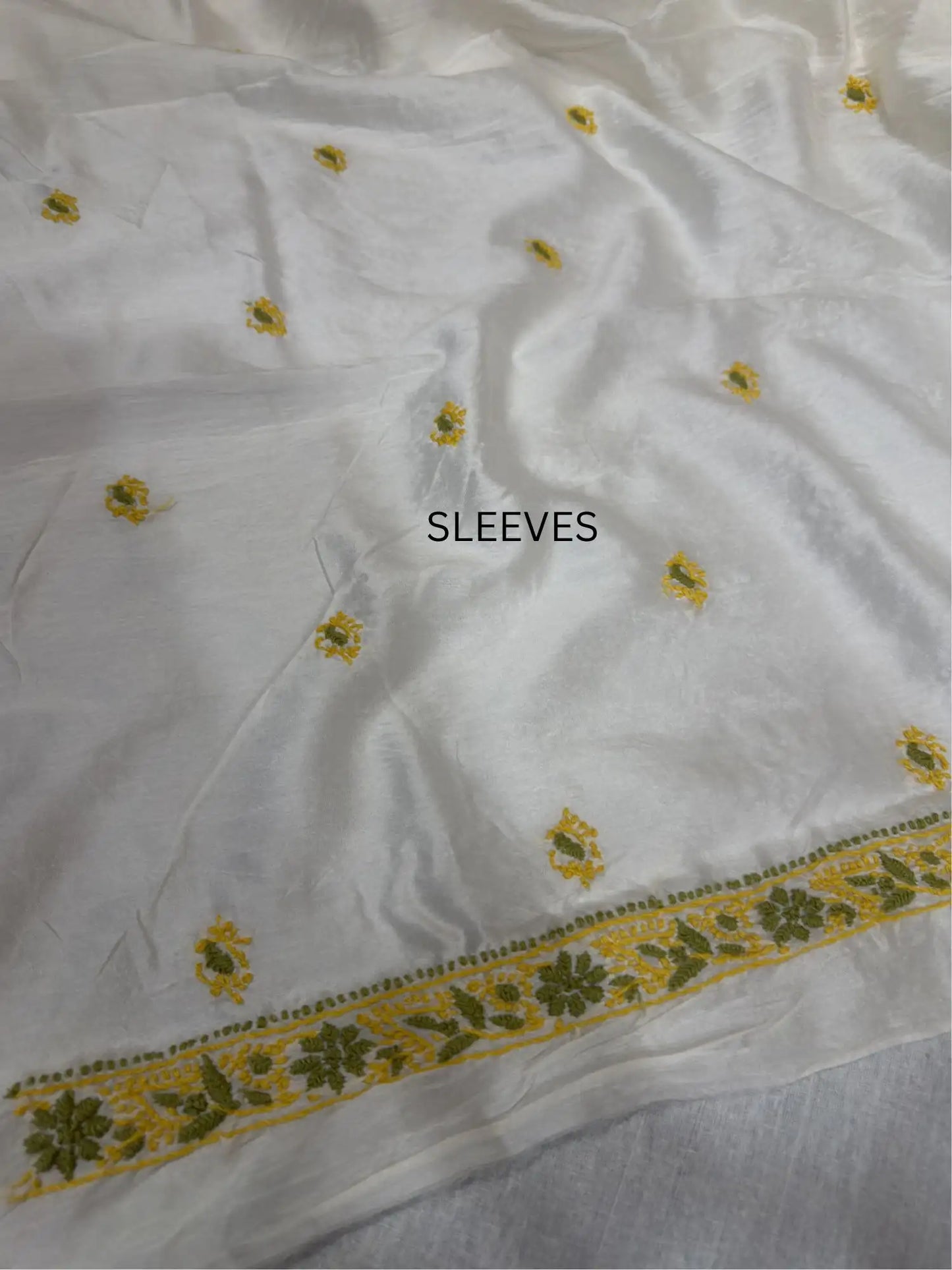 Elegant mustard yellow and olive green Chikankari sleeve embroidery on ivory dyeable Chanderi Silk kurta fabric.