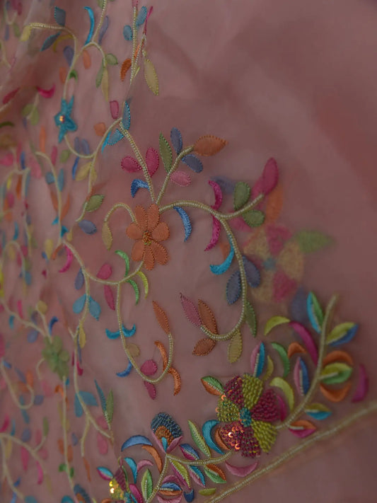 Close-up of rose gold Pure Organza Silk suit with multicolour floral embroidery and pearl detailing