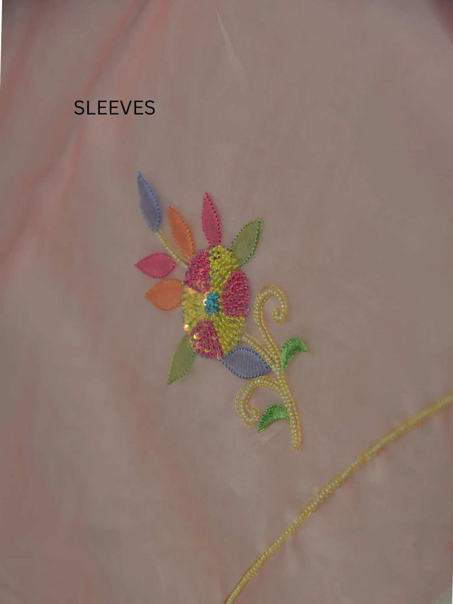 Full sleeve detail of rose gold Pure Organza Silk suit with floral Parsi Shadow embroidery