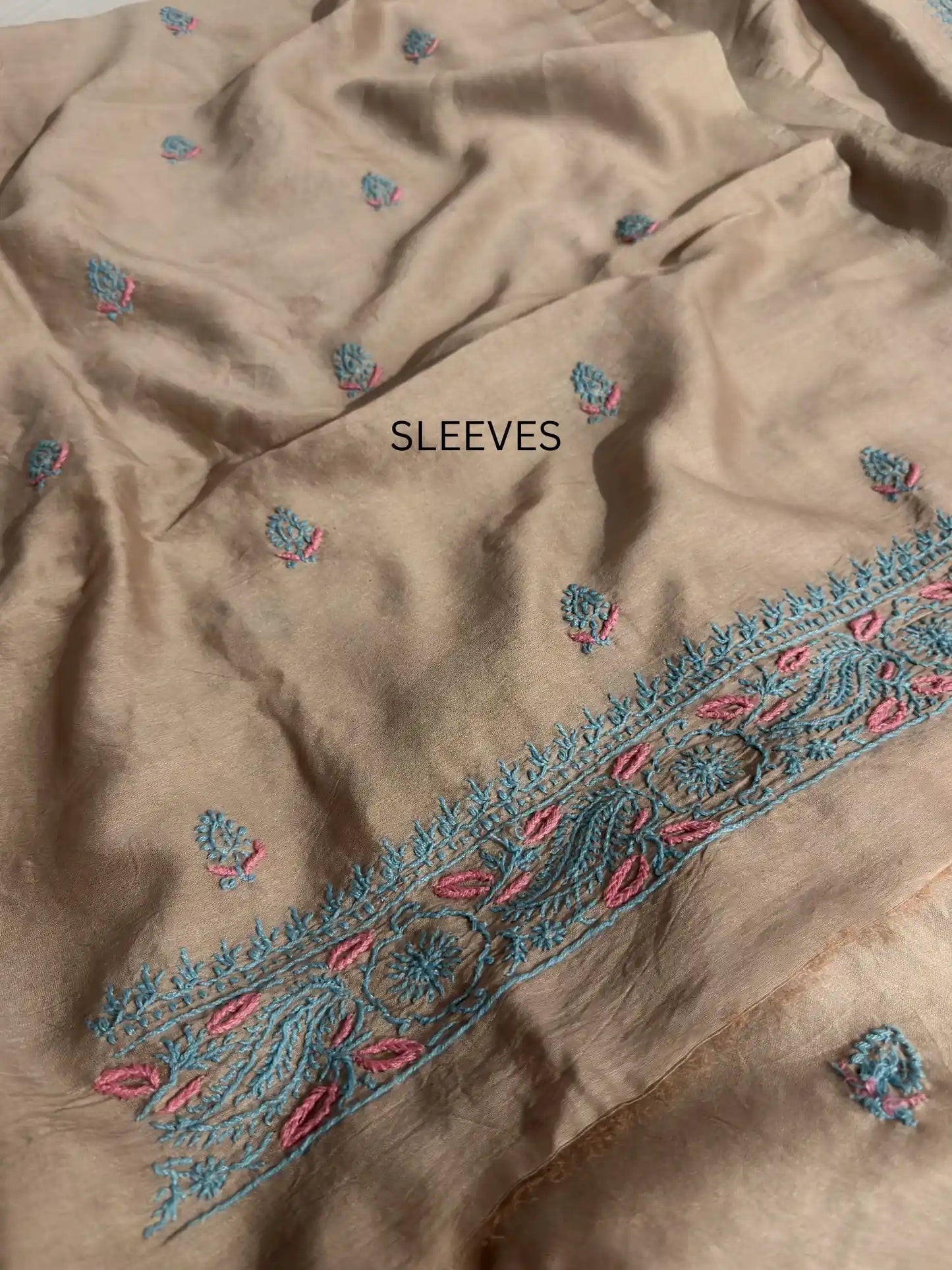 Fine turquoise and pink Lucknowi Chikankari sleeve embroidery on Taupe Brown Chanderi Silk kurta fabric.
