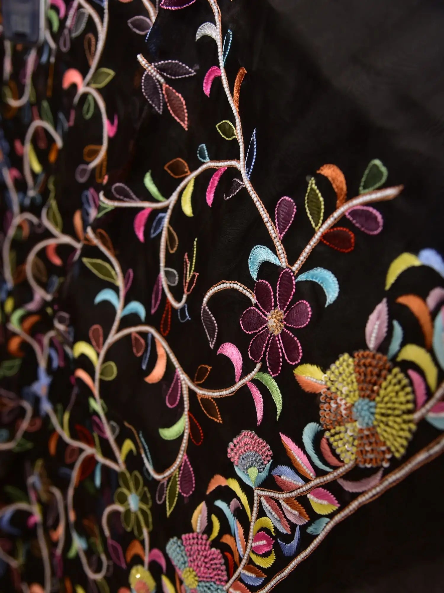 Intricate multicolour floral embroidery pattern on black Pure Organza Silk fabric