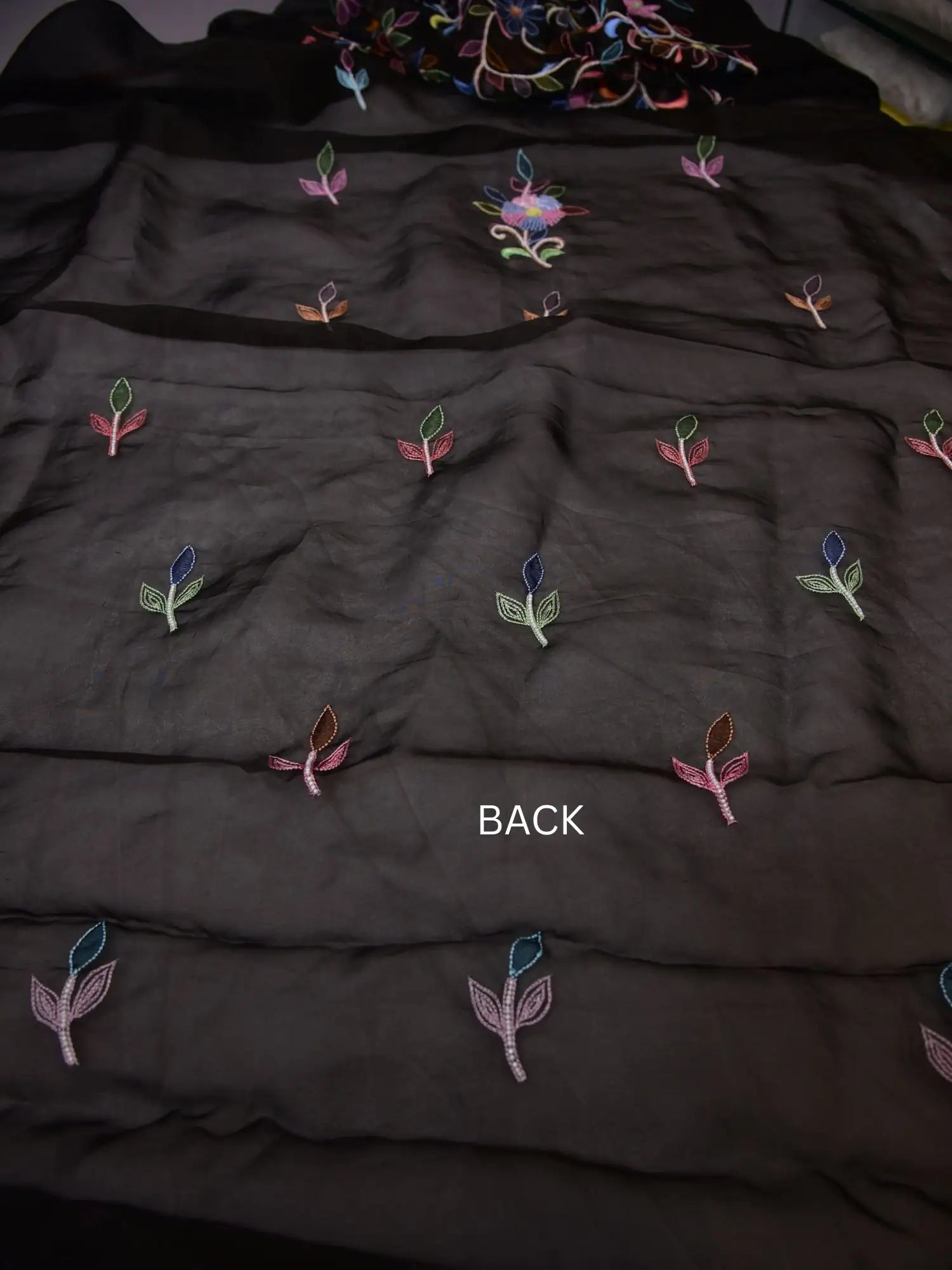 Back view of black Pure Organza Silk straight suit with multicolour floral motifs