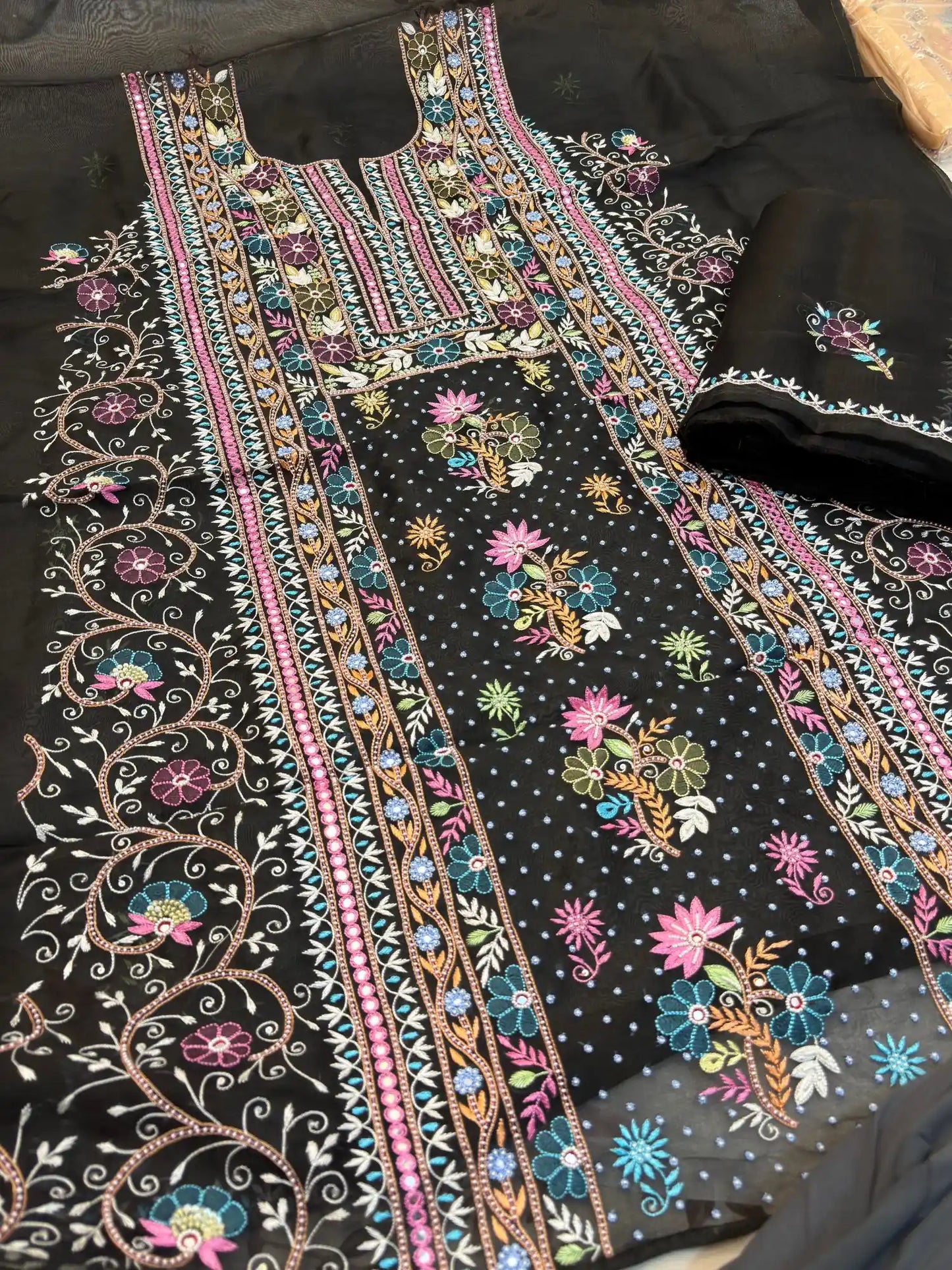 Side view of black Pure Organza Silk straight suit with full sleeves and floral embroidery
