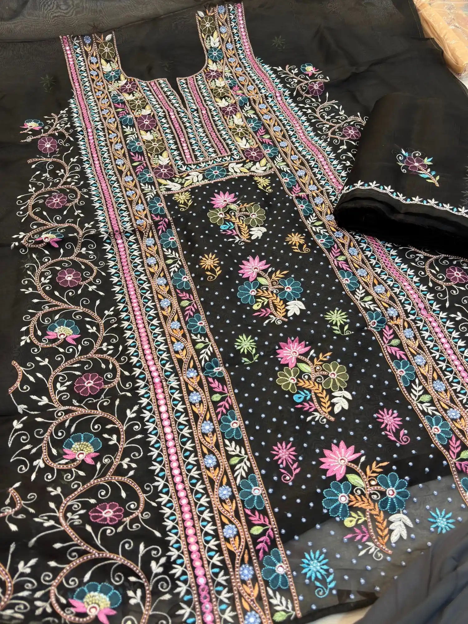Side view of black Pure Organza Silk straight suit with full sleeves and floral embroidery