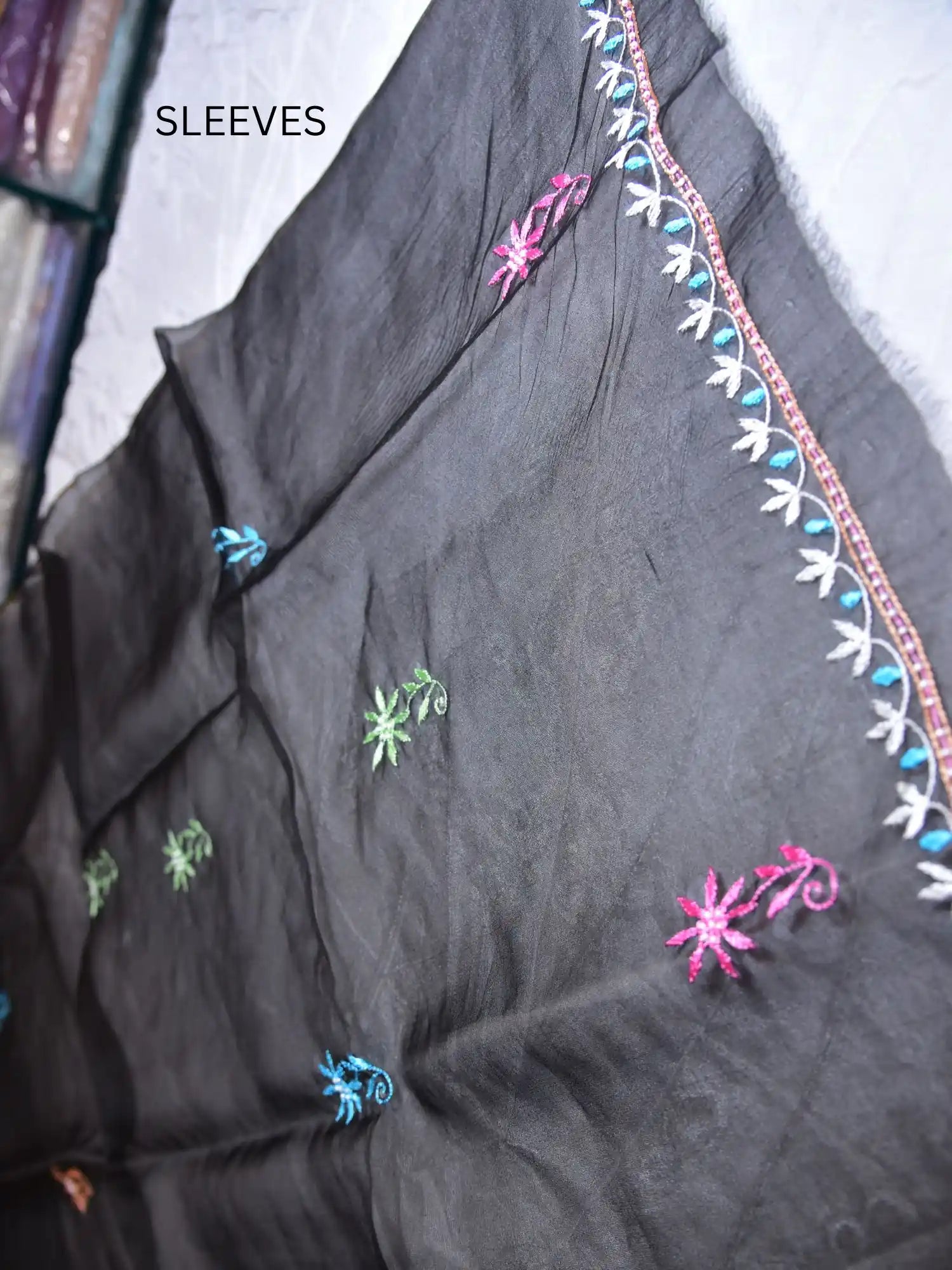 Full sleeve detail of black Pure Organza Silk suit with multicolour floral Parsi Shadow embroidery