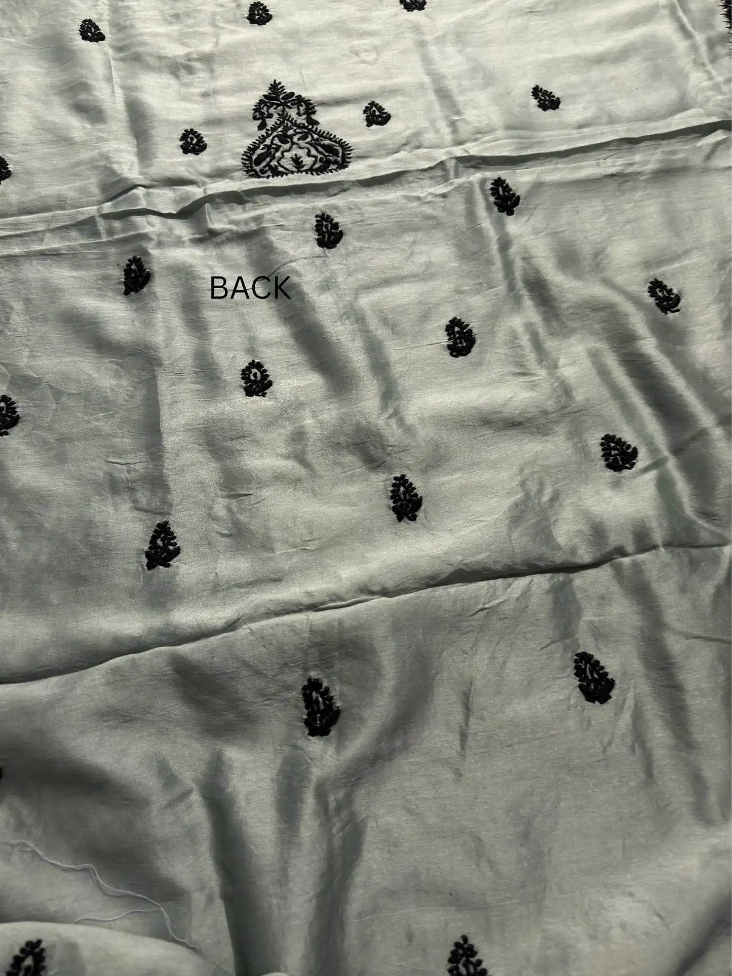 Elegant black Lucknowi Chikankari back embroidery on Celadon Green Chanderi Silk kurta fabric.