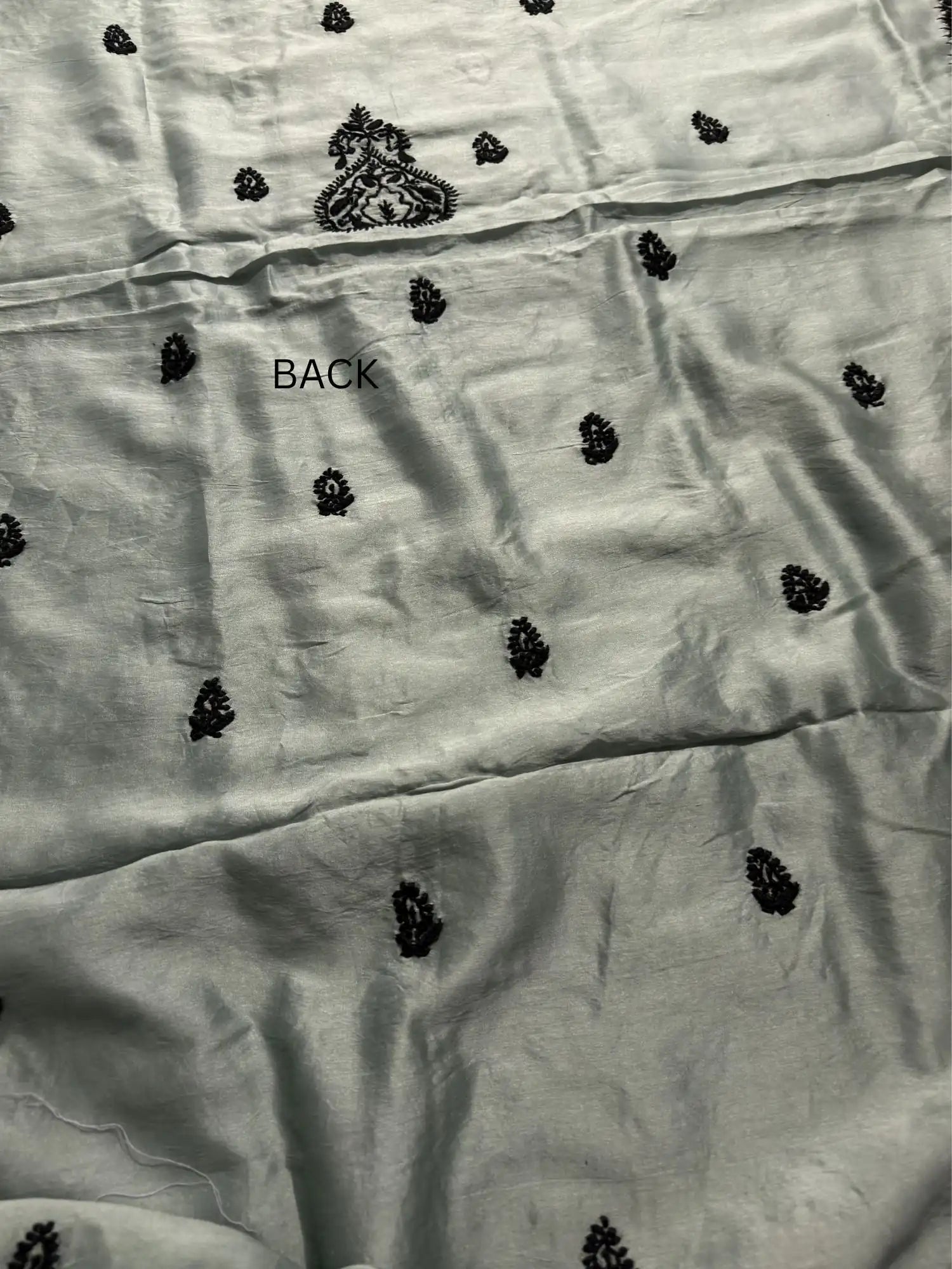 Elegant black Lucknowi Chikankari back embroidery on Celadon Green Chanderi Silk kurta fabric.