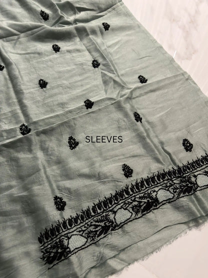 Delicate black Chikankari sleeves embroidery across Celadon Green Chanderi Silk unstitched kurta fabric.
