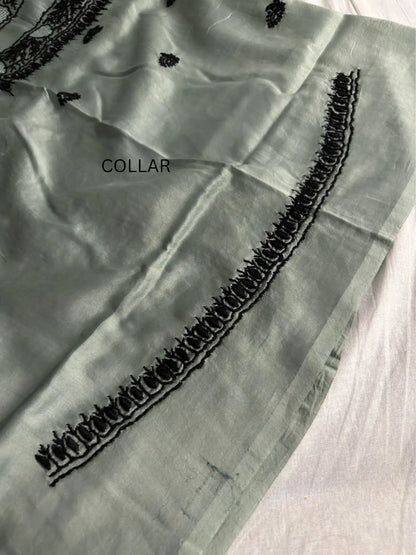 Intricate black Lucknowi Chikankari embroidery on the collar of Celadon Green Chanderi Silk unstitched kurta fabric.