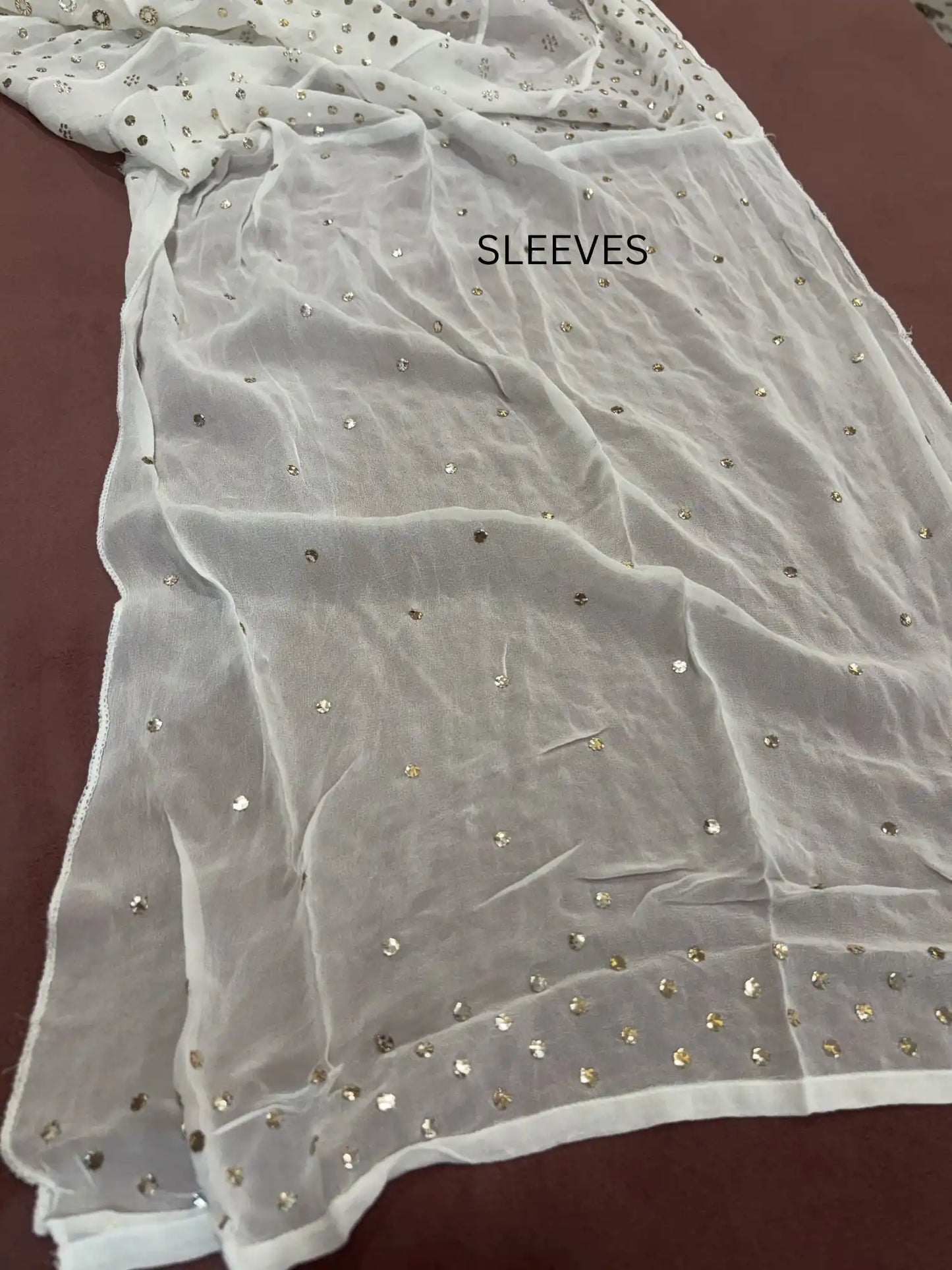 sleeves with handcrafted gold-toned Mukaish work of circles.