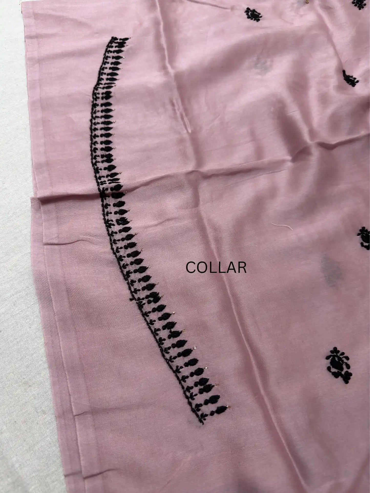 Detailed Lucknowi Chikankari embroidery on the collar of Dusty Mauve linen kurta fabric.