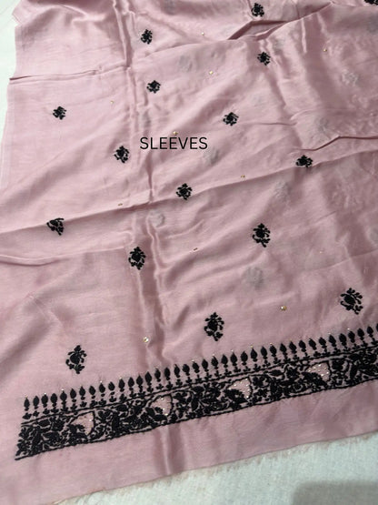 Fine Lucknowi Chikankari embroidery on the sleeve of Dusty Mauve linen kurta fabric.