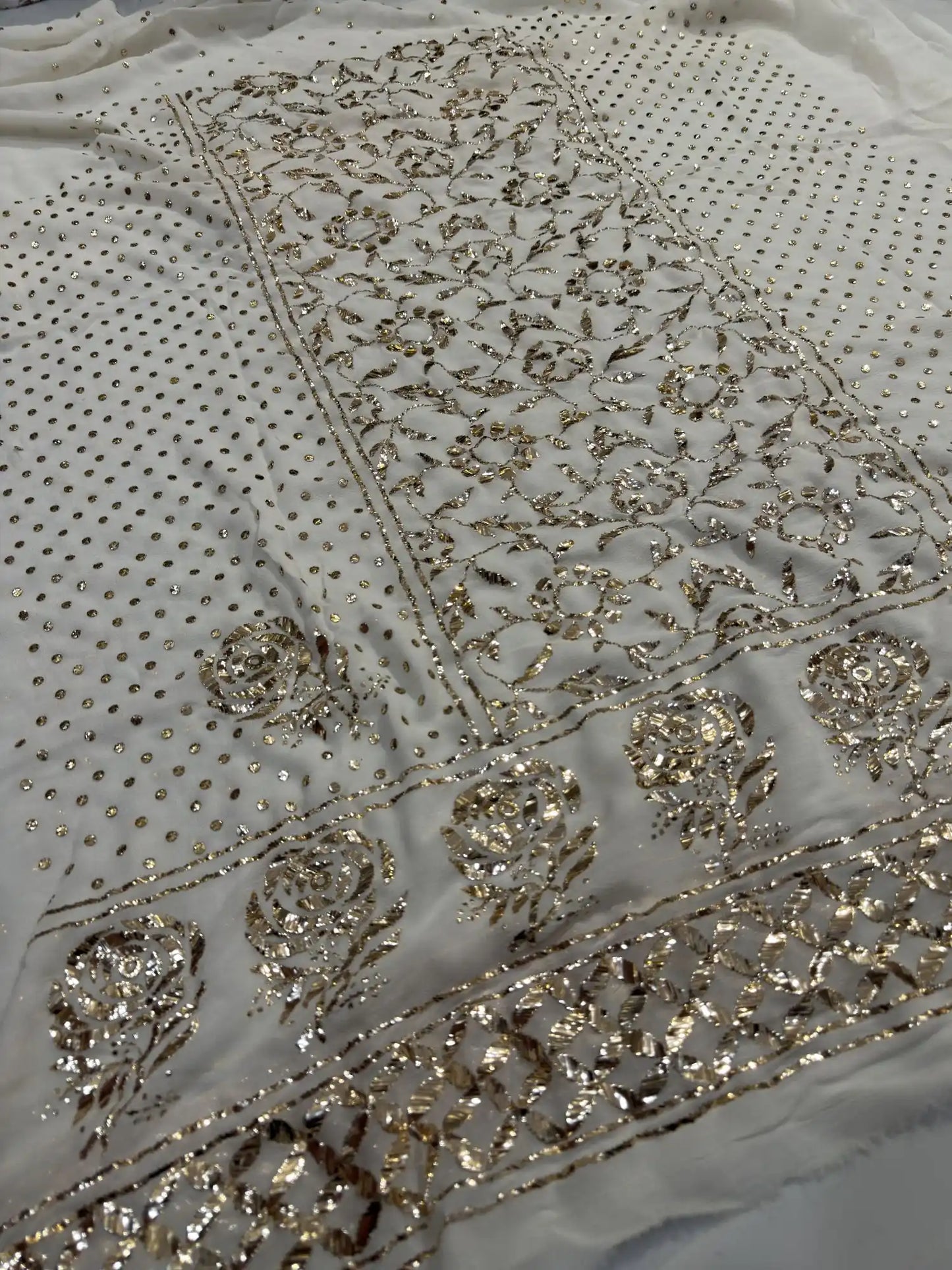 Floral Badla and Mukaish embroidered border detail on an off white Lucknowi Kurta Set