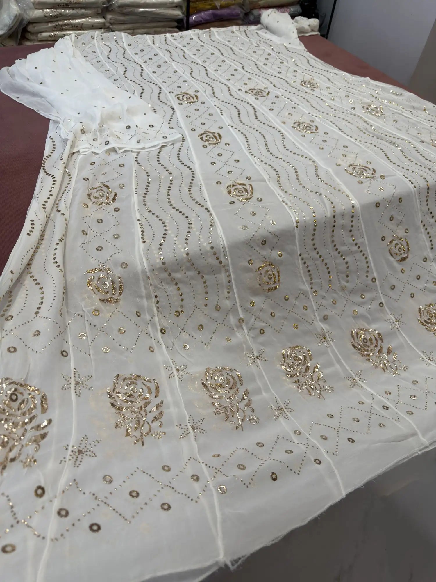 Close-up of handcrafted gold-toned Mukaish, Kamdani, Badla and Pearl embroidery