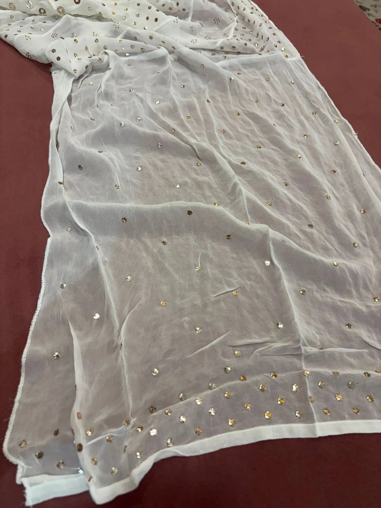 Close-up of heavy gold-toned Mukaish, Badla and Pearl hand embroidery on Lucknowi Chikankari Anarkali
