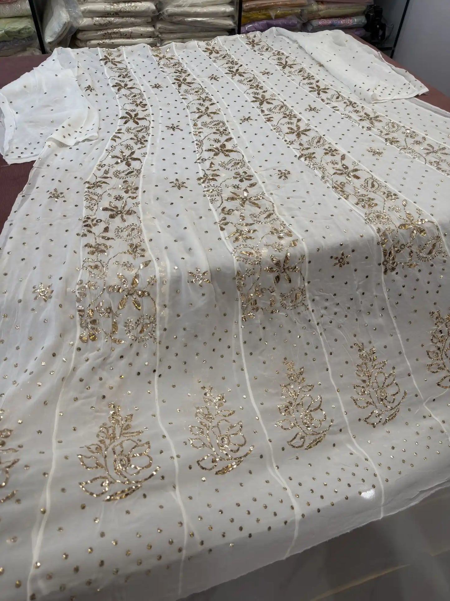 Back view of handcrafted Lucknowi Chikankari Georgette Anarkali with heavy gold Mukaish work