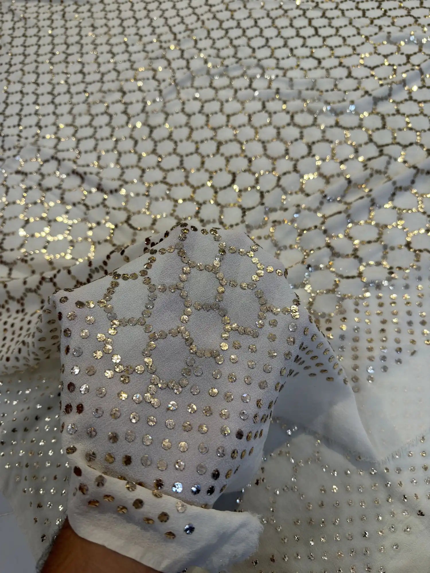 Close-up of geometric honeycomb Mukaish and Kamdani handwork on a White Pure Georgette dupatta
