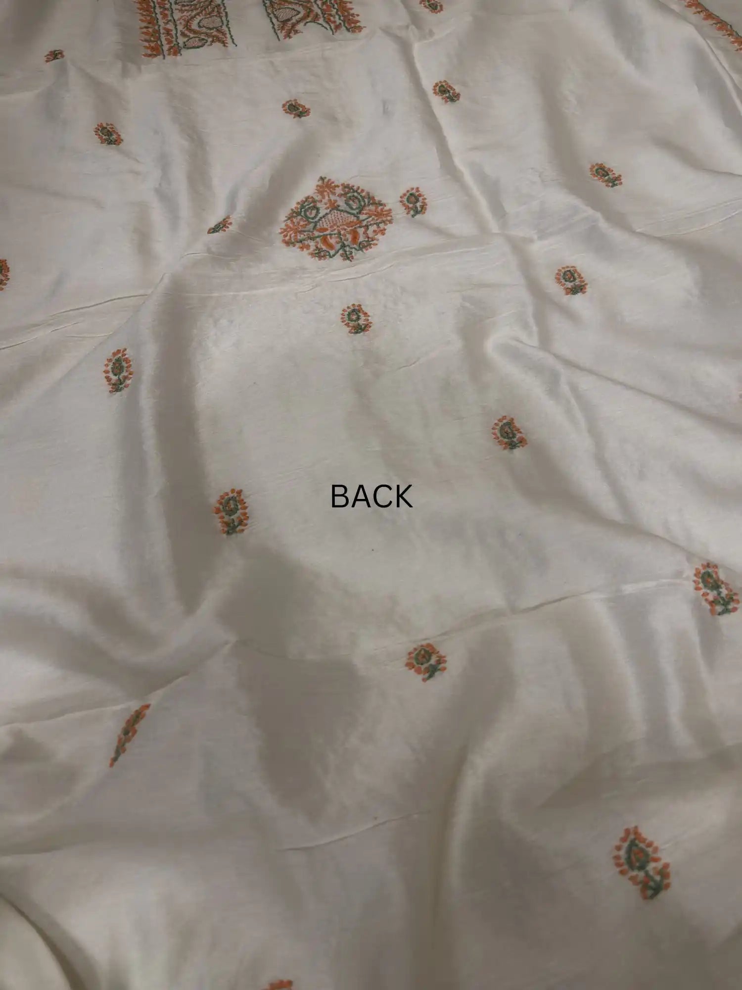 Delicate handcrafted peach and sage green Chikankari back embroidery across ivory dyeable Chanderi Silk kurta fabric.