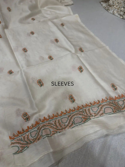 Elegant peach and sage green Lucknowi Chikankari sleeve embroidery on ivory dyeable Chanderi Silk kurta fabric.