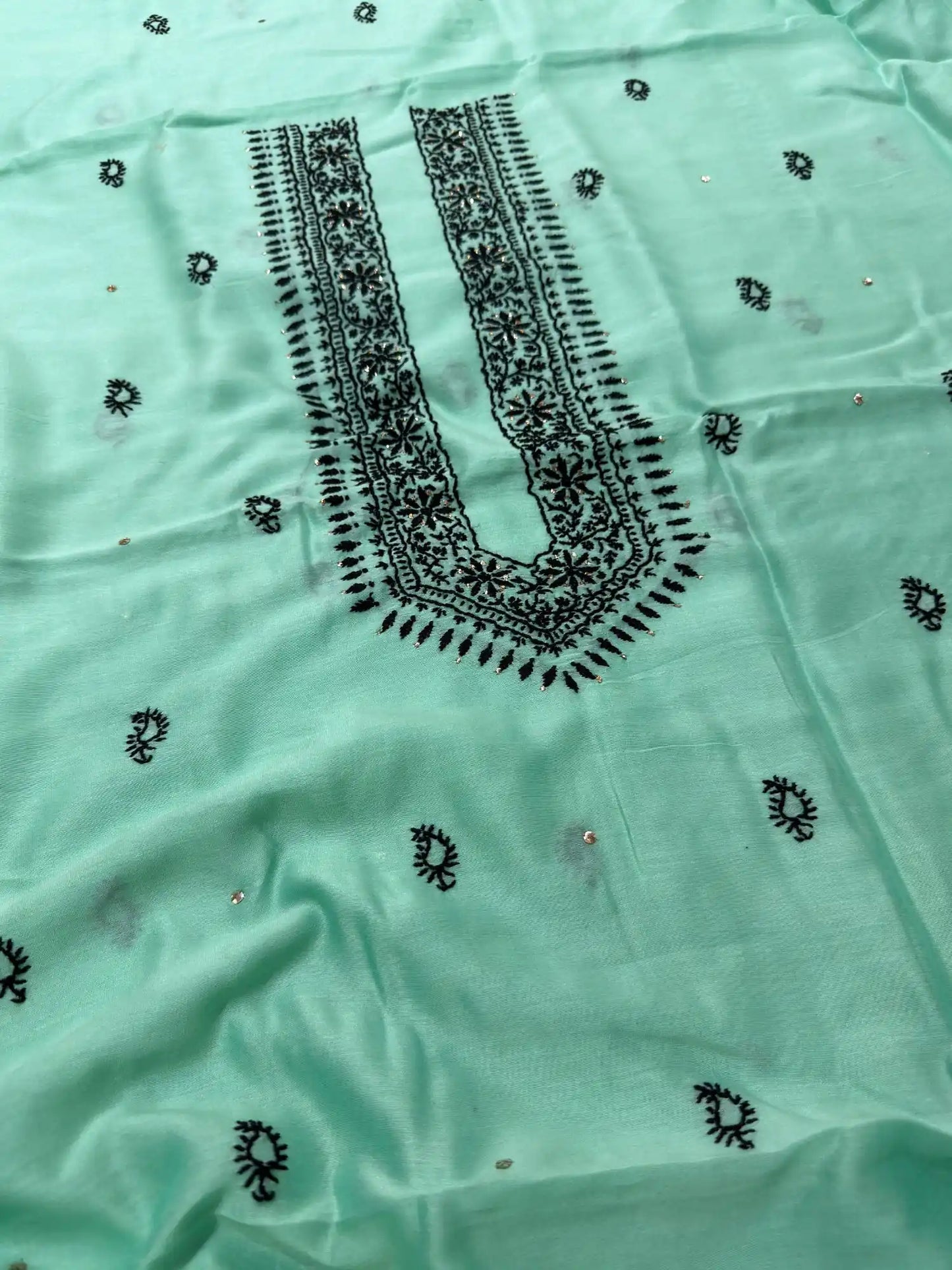 Front detail of Lavender Mist Chanderi Silk fabric featuring white Chikankari embroidery and hand Mukaish work.