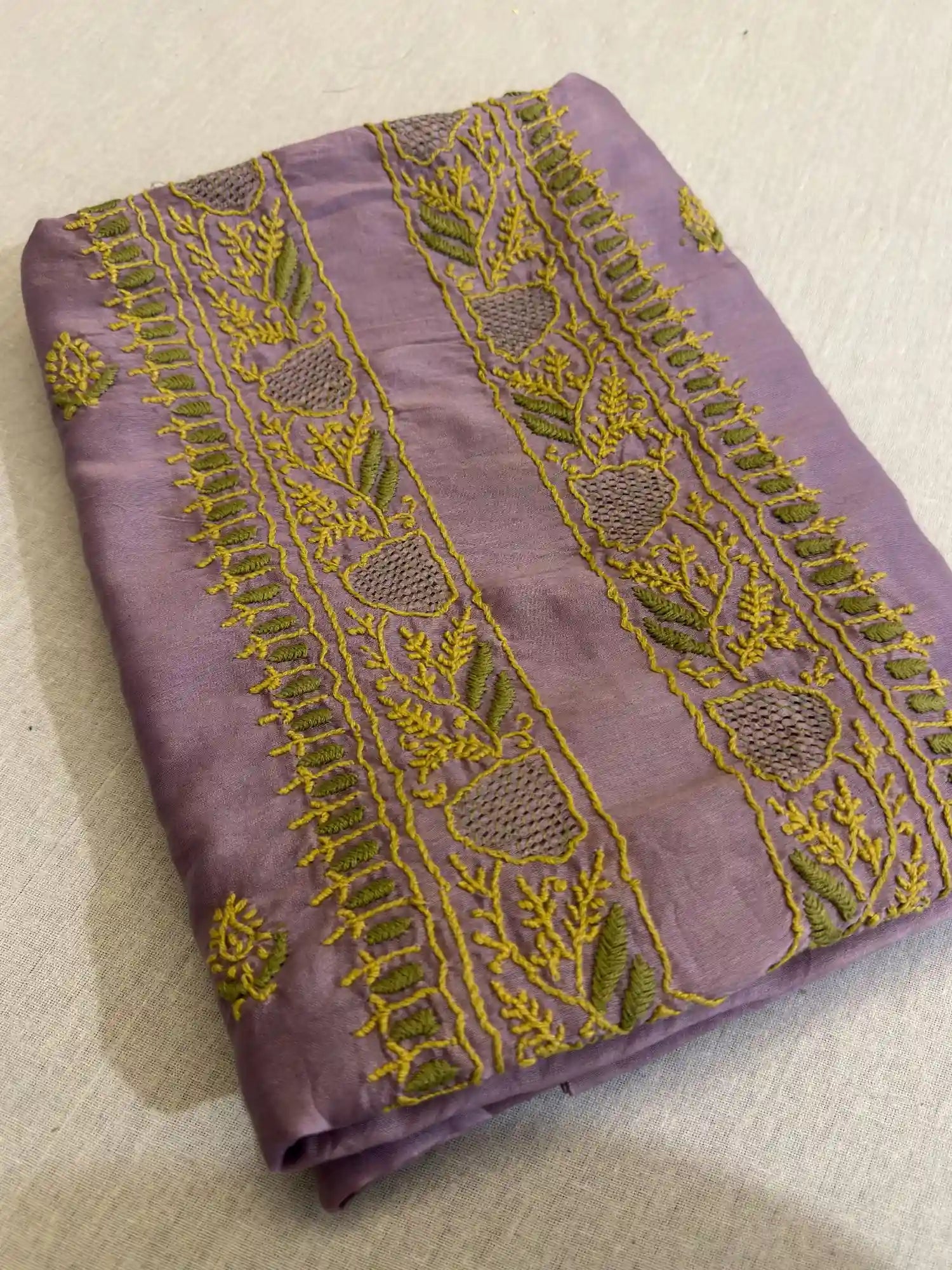 Close-up of premium Mauve Purple Chanderi Silk fabric highlighting authentic Lucknowi Chikankari embroidery and fine woven texture.
