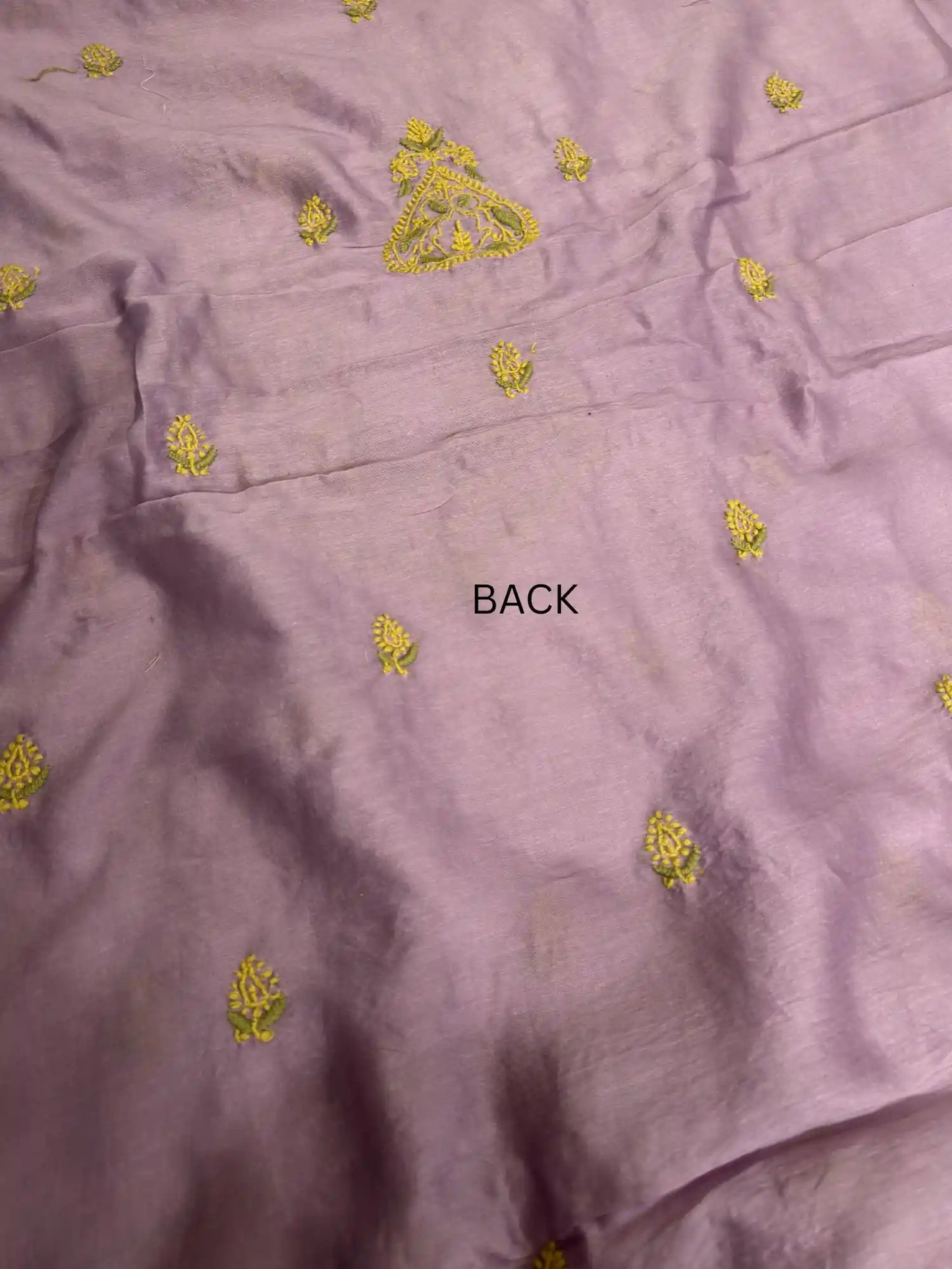Delicate handcrafted Lucknowi Chikankari back embroidery across Mauve Purple Chanderi Silk kurta fabric.