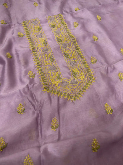 Close-up of mustard yellow and olive green Lucknowi Chikankari embroidery on the neckline of Mauve Purple Chanderi Silk fabric.