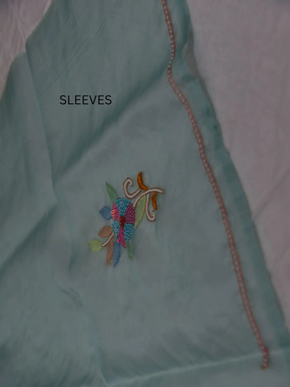Full sleeve detail of mint green Pure Organza Silk suit with floral Parsi Shadow embroidery