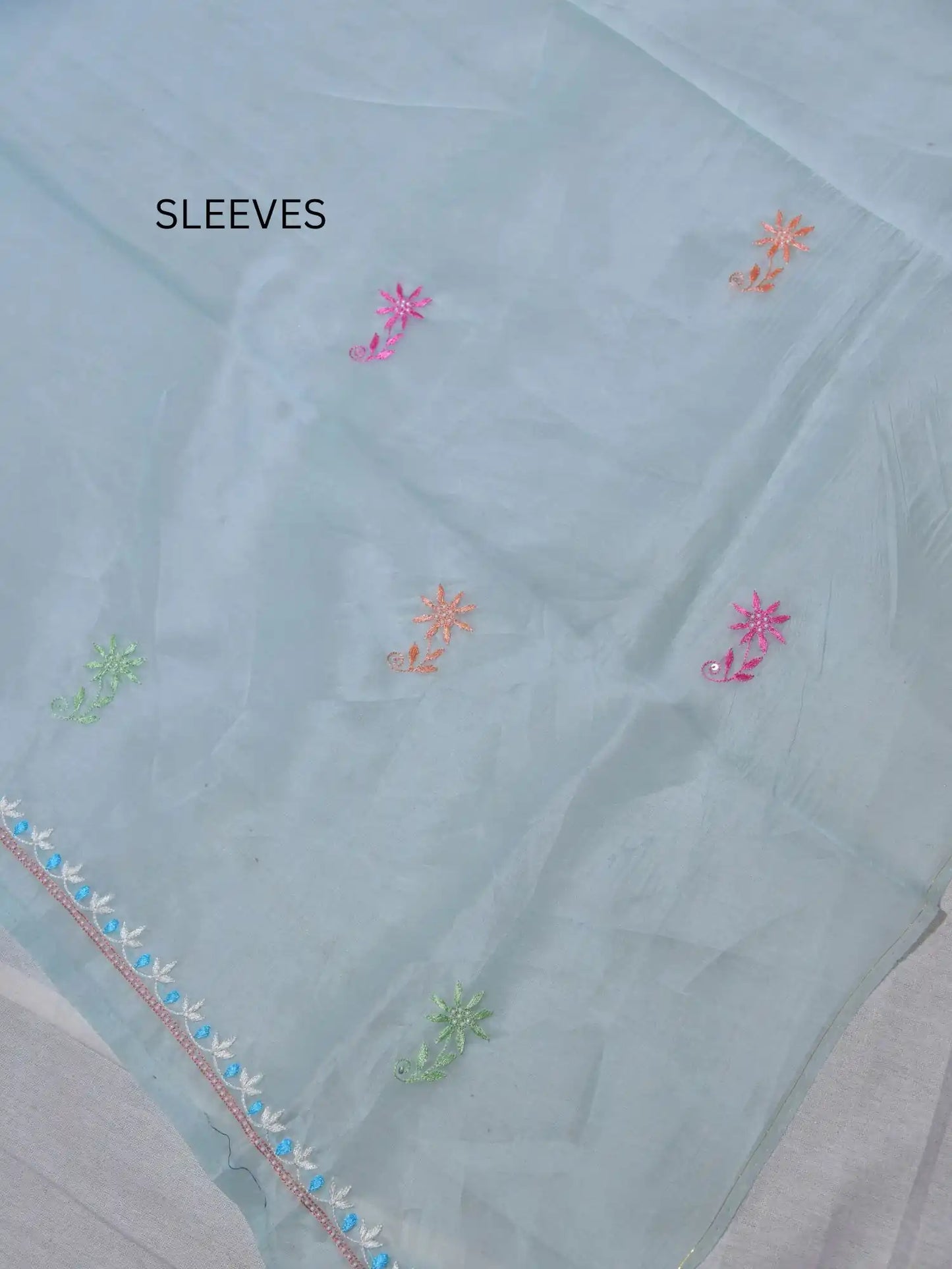 Full sleeve detail of pastel sea green Pure Organza suit with floral Parsi Shadow embroidery