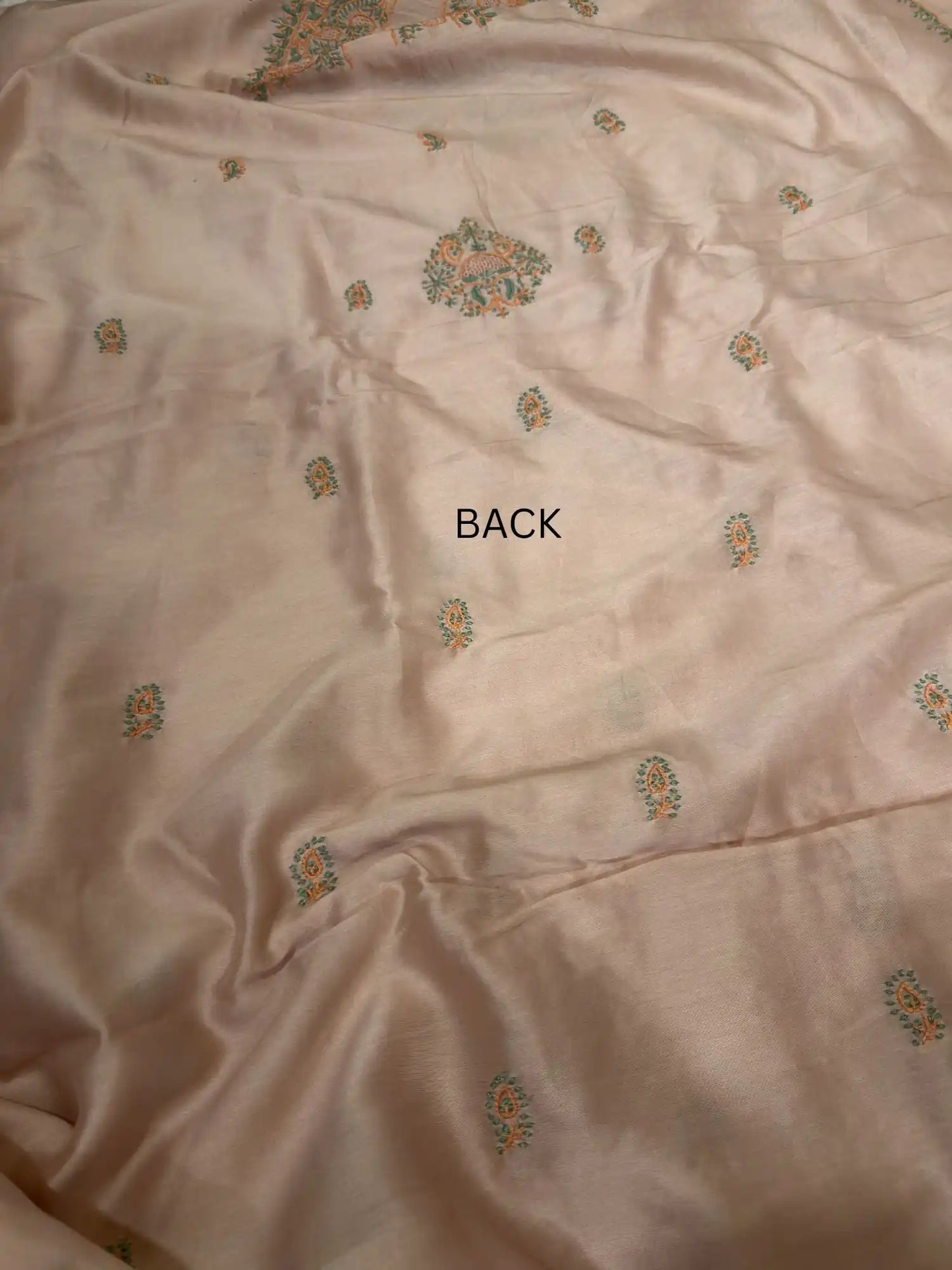 Delicate handcrafted Lucknowi Chikankari back embroidery across Peach Chanderi Silk unstitched kurta fabric.