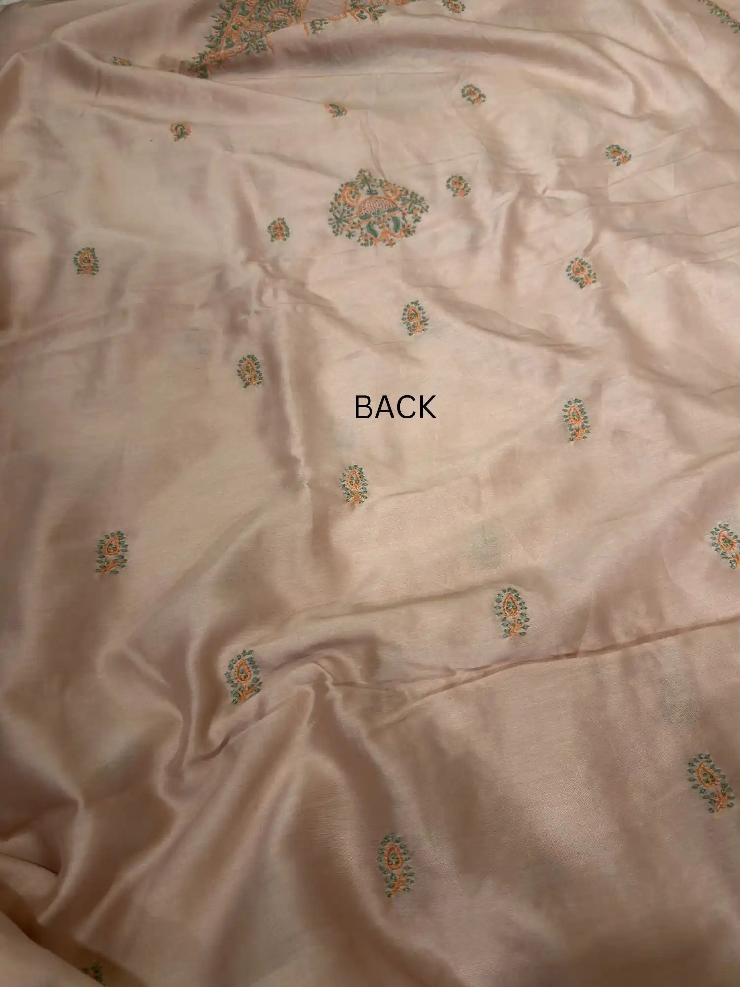 Delicate handcrafted Lucknowi Chikankari back embroidery across Peach Chanderi Silk unstitched kurta fabric.