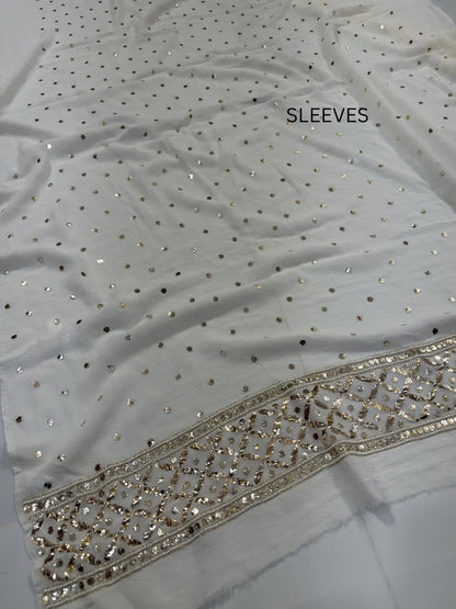 Handcrafted pearl, Badla and Mukaish border detail on a White Lucknowi Kurta Set Sleeves