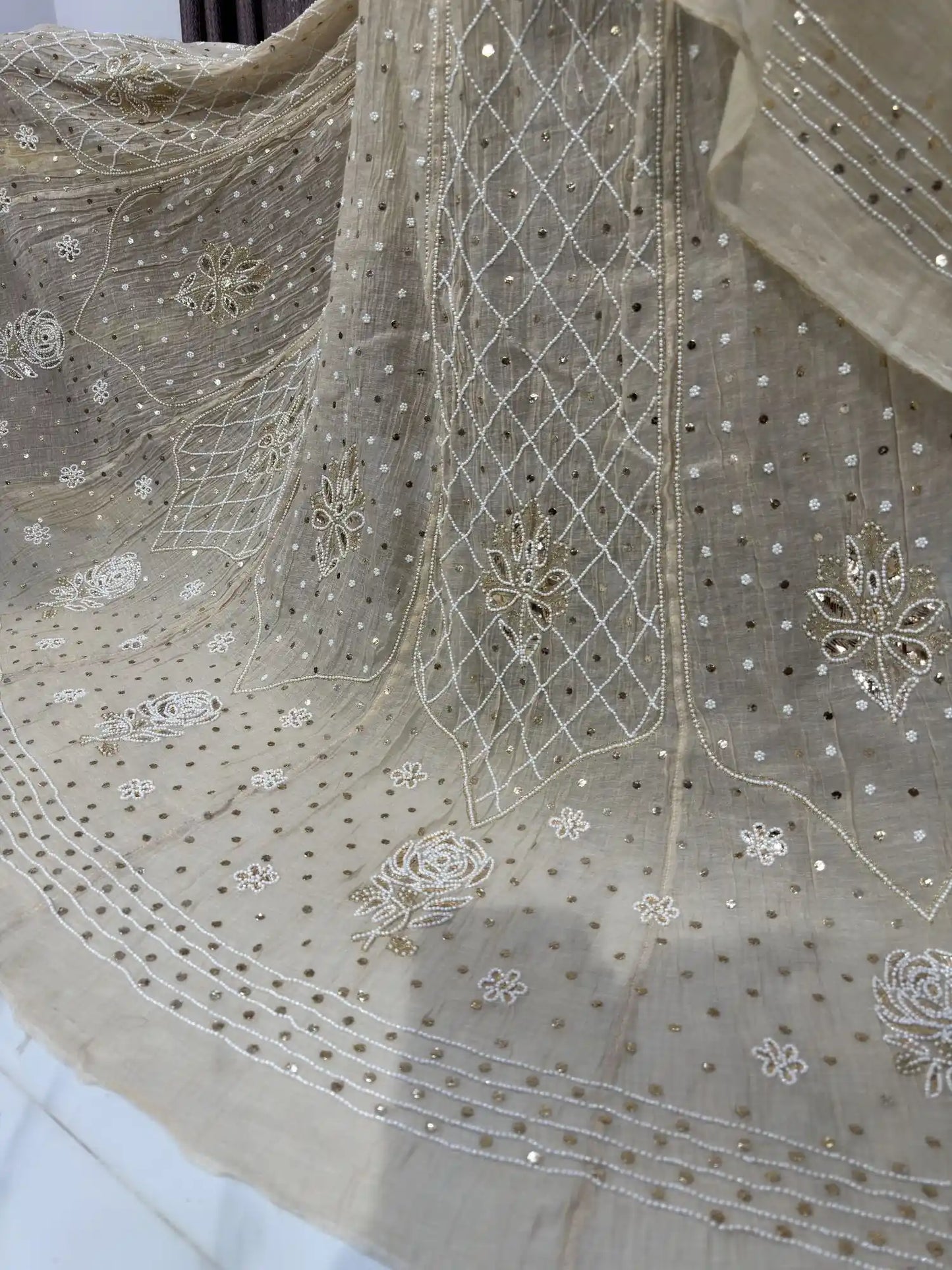 Close-up of the petal floral embroidery on the Lucknowi Chikankari Lehenga.