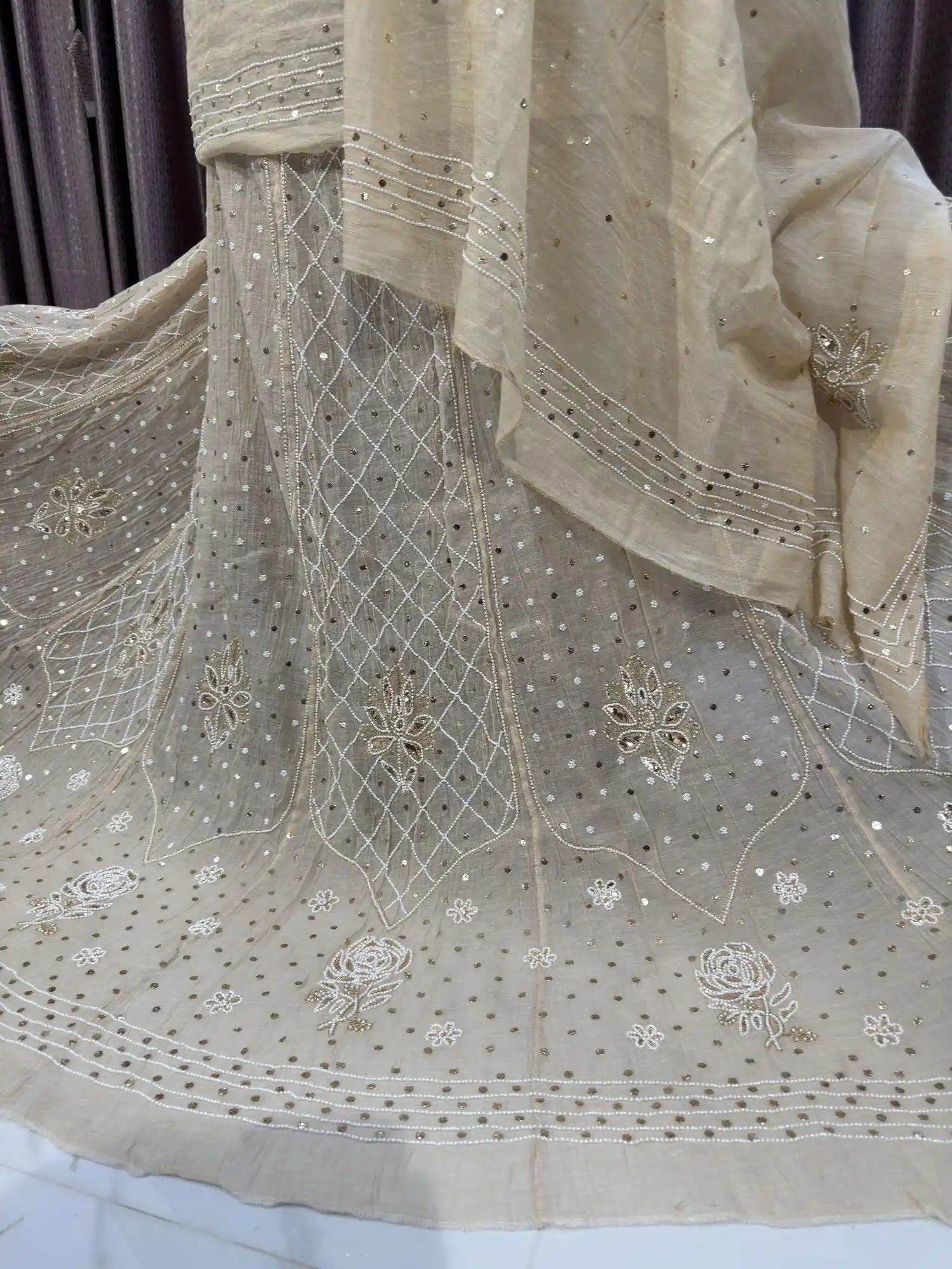 Side view of Petal Floral Lucknowi Chikankari Lehenga featuring intricate floral motifs.