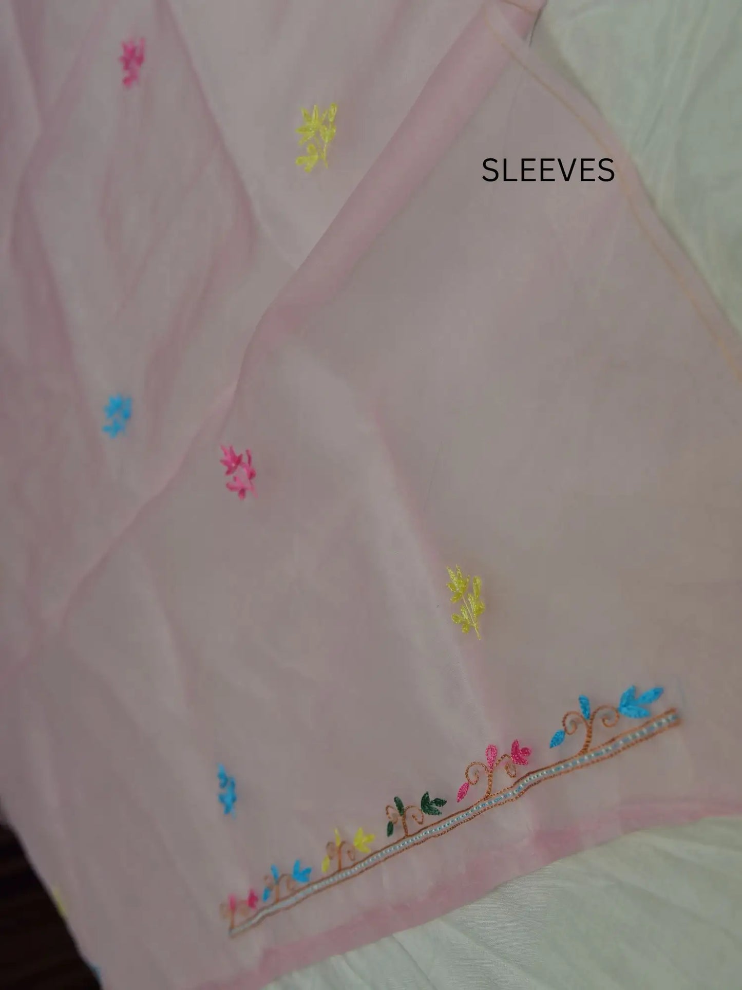 Full sleeve detail of pink Pure Organza Silk suit with floral Parsi Shadow embroidery