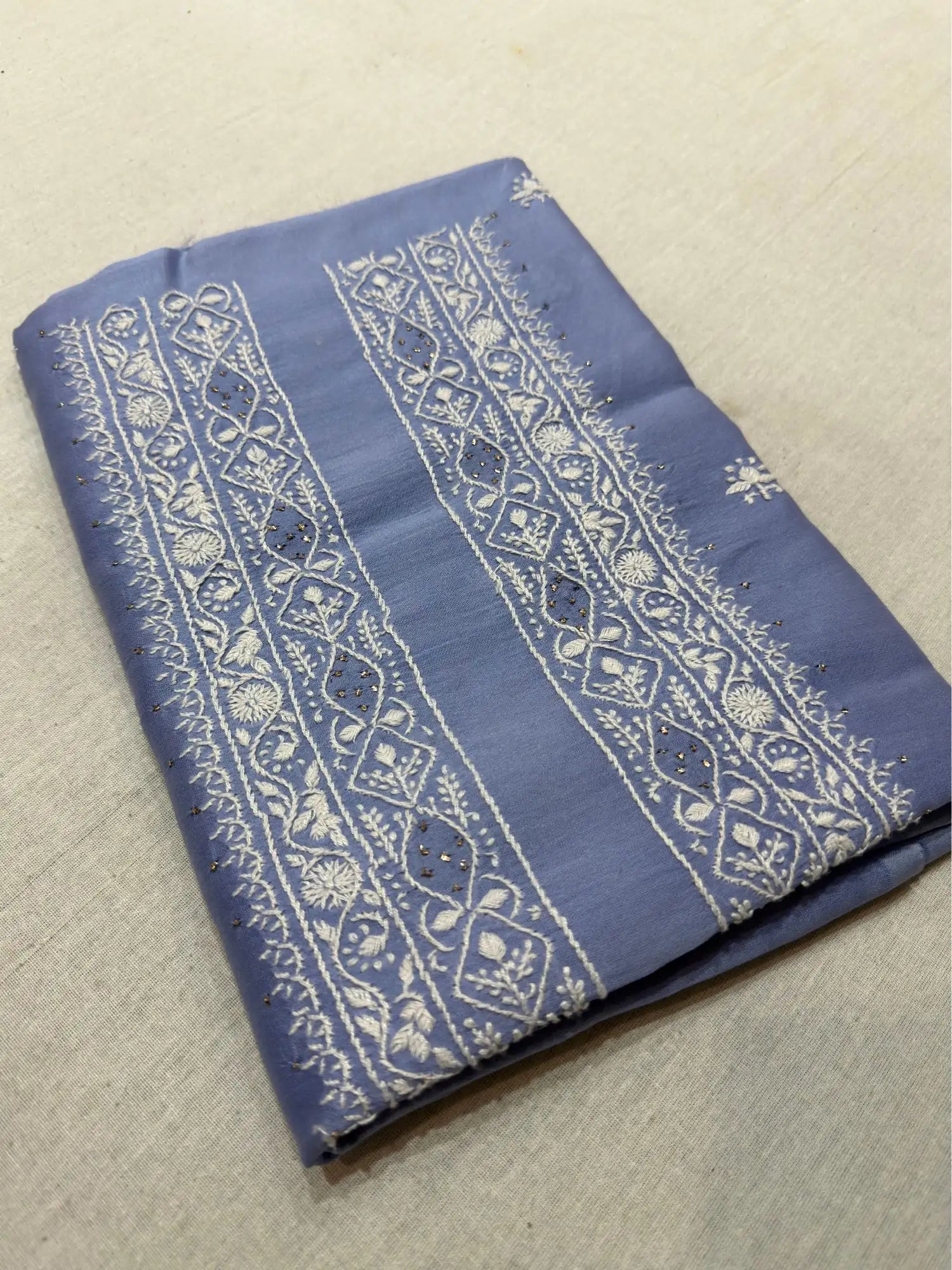 Powder Blue linen Lucknowi Chikankari unstitched kurta fabric with fine white embroidery.
