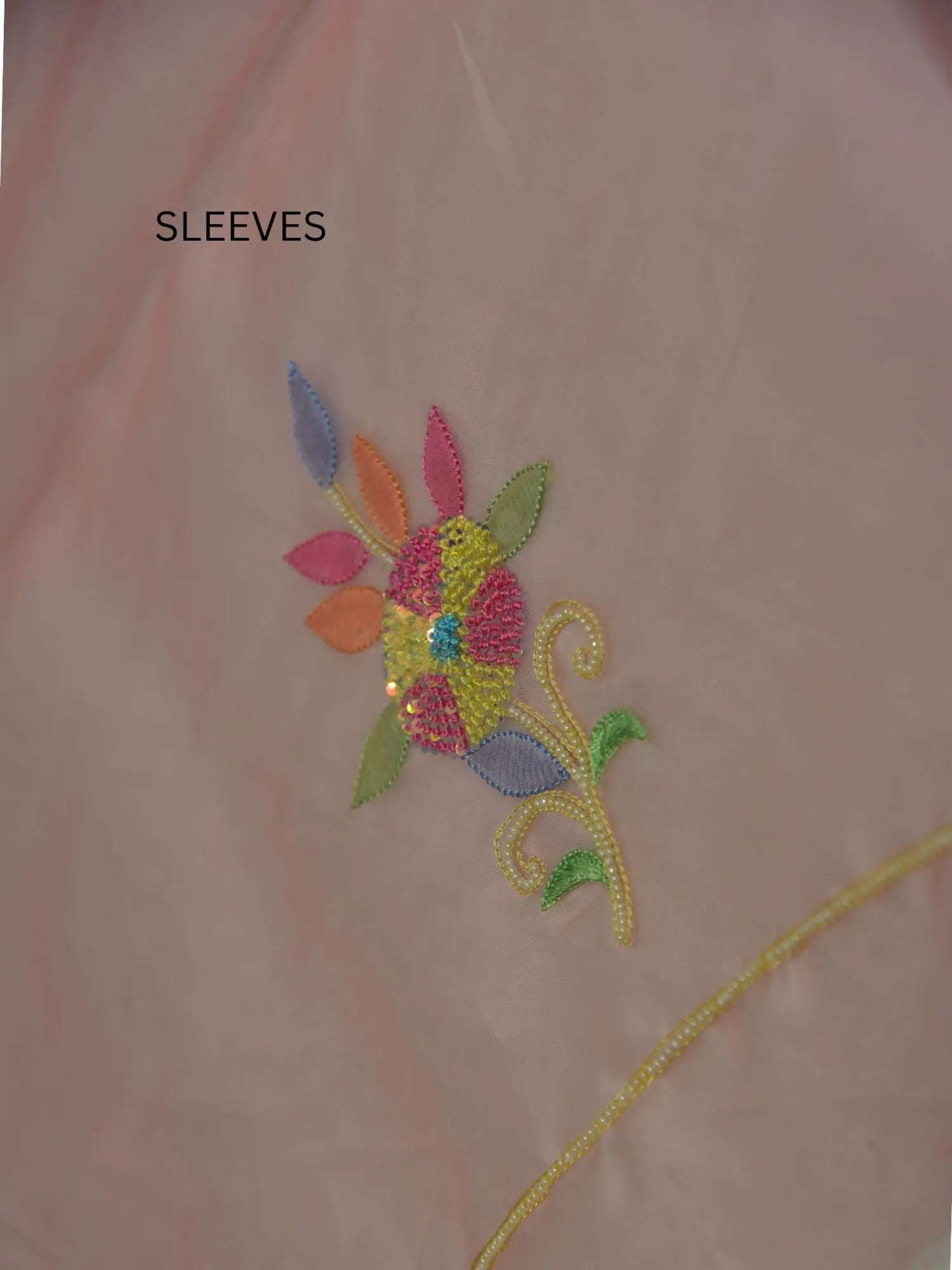 Full sleeve detail of rose gold Pure Organza Silk suit with floral Parsi Shadow embroidery