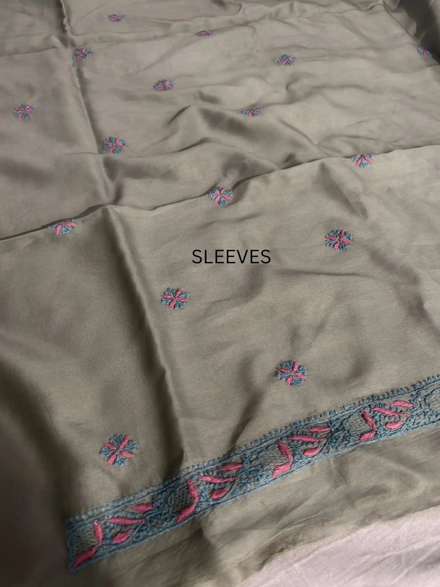Fine turquoise and pink Lucknowi Chikankari sleeve embroidery on Sage Green Chanderi Silk kurta fabric.