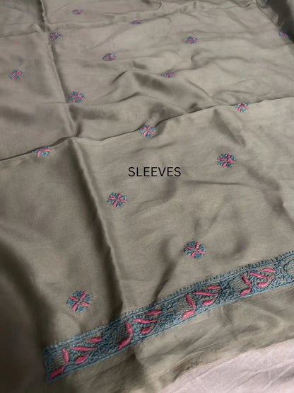 Fine turquoise and pink Lucknowi Chikankari sleeve embroidery on Sage Green Chanderi Silk kurta fabric.
