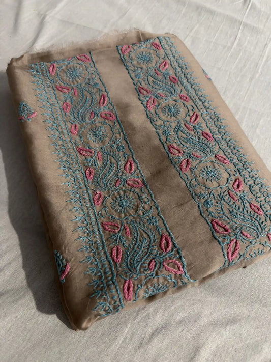 Folded Taupe Brown Chanderi Silk Lucknowi Chikankari kurta fabric showcasing elegant turquoise and pink embroidery.
