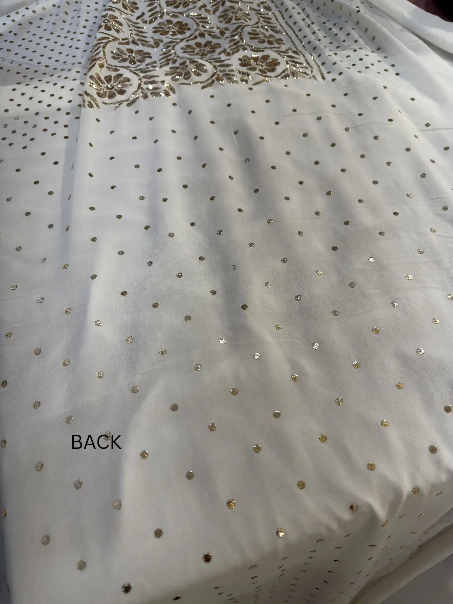 Back view of a white Lucknowi Kurta Set with handcrafted Mukaish dana work